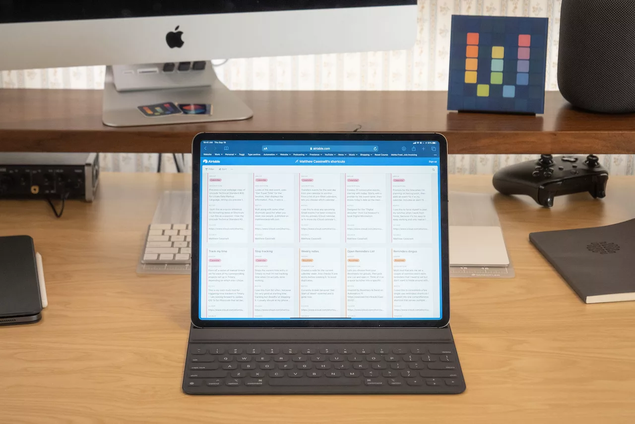 Photograph of Matthew Cassinelli's Shortcuts Library open on his iPad on his desk.